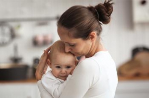 Mother holding young child